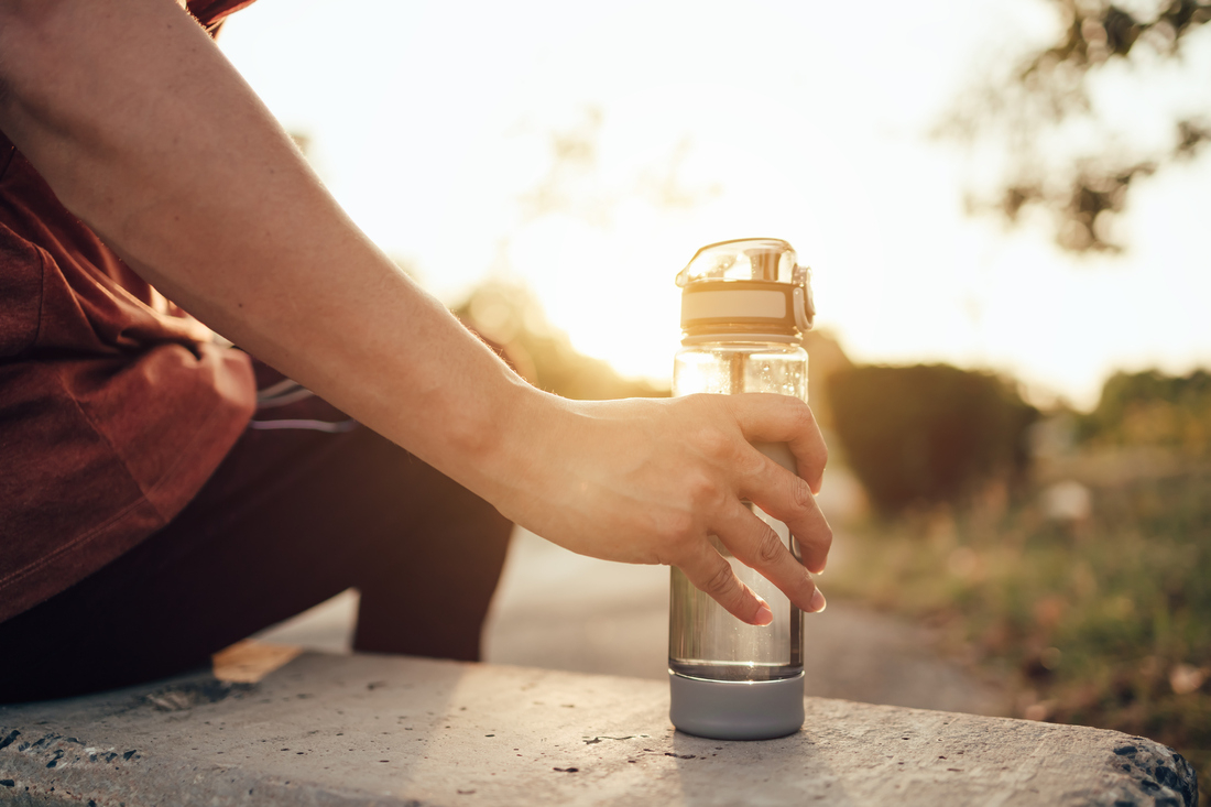 Close Up Young Man Hand Holding Fresh Drinking Cold Water Bottle