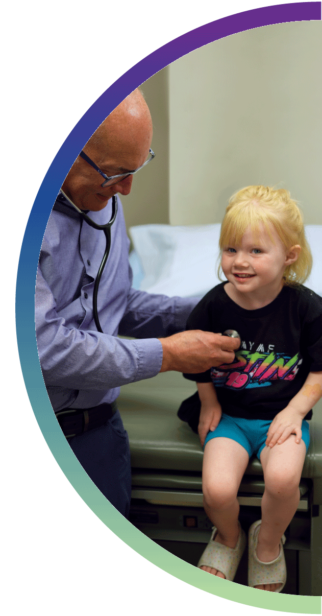 Pediatrics doctor holding stethoscope on child